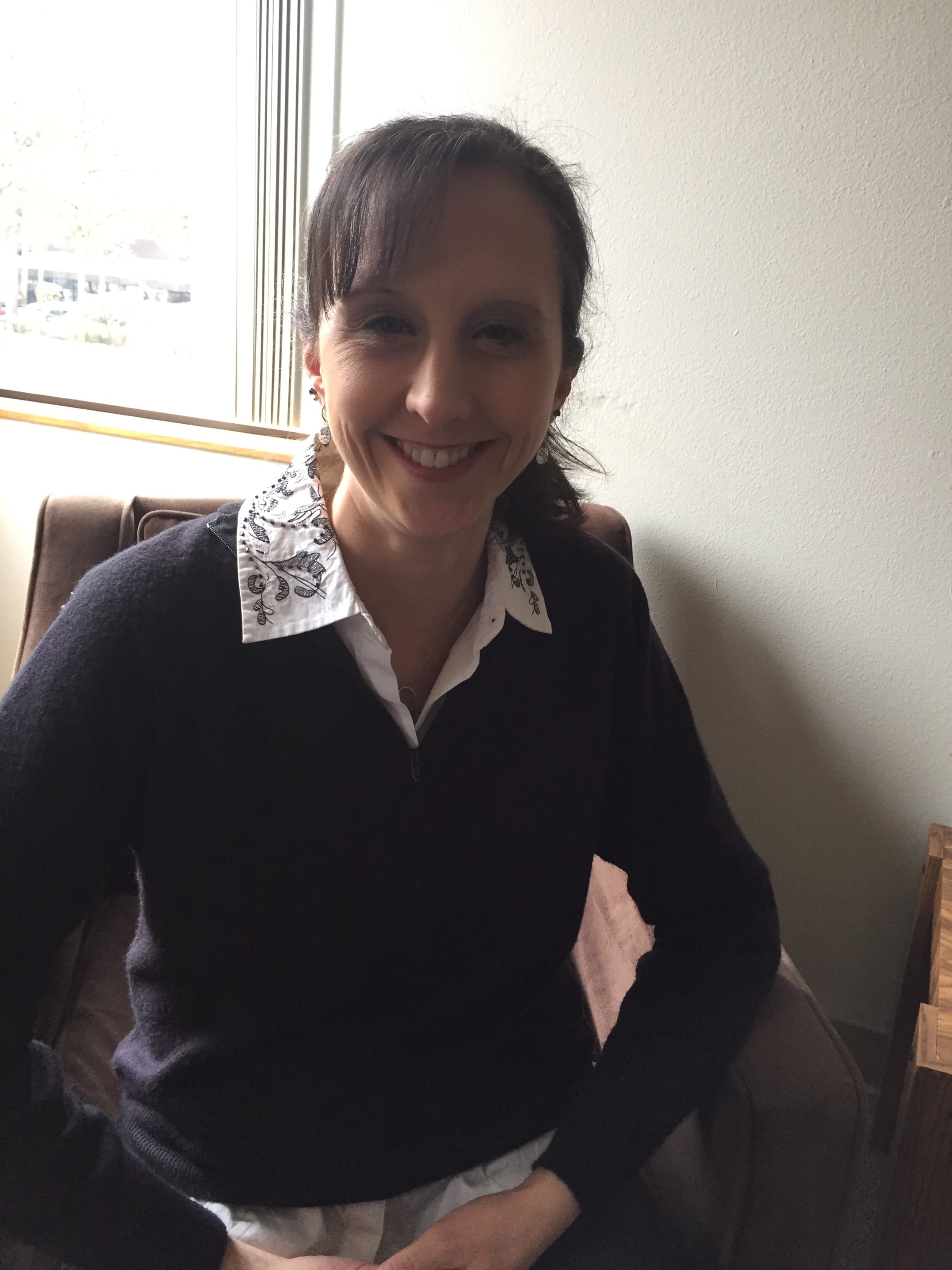 Alli Santa seated in her counseling office
